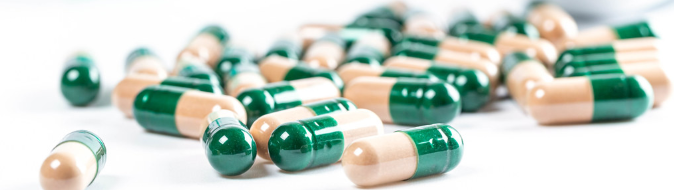 green and cream colored capsules